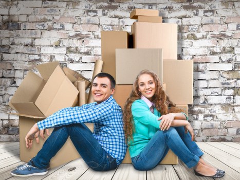 Removal van and moving team in a Ruislip residential street