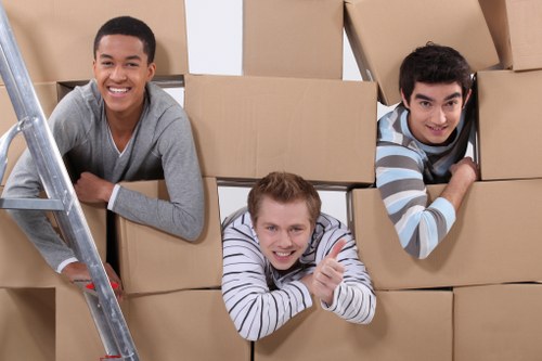 Room-by-room moving boxes labeled and stacked for relocation in Ruislip