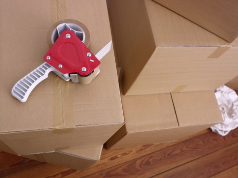 Packed office boxes and furniture prepared for relocation