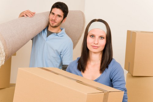 Packed moving boxes and furniture ready for collection in Ruislip