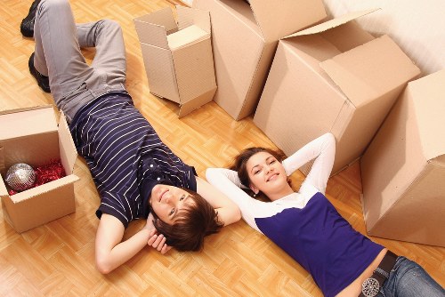 Team member using protective gear while moving furniture